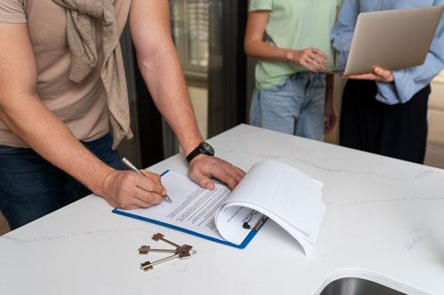 side-view-buyer-signing-document side-view-buyer-signing-document